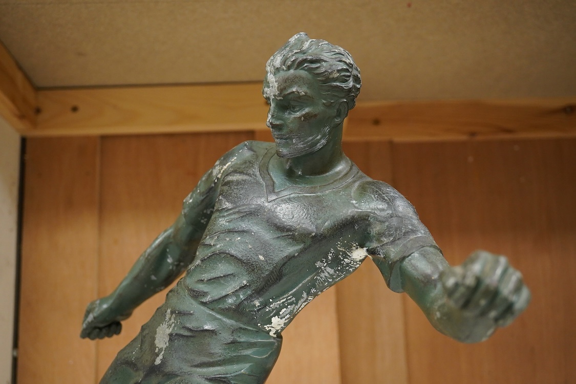 A mid 20th century aluminium cast sculpture of a footballer on stand- 35.5cm wide
